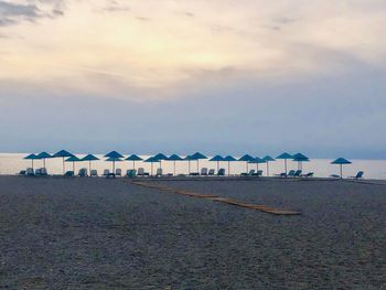 Scenic view of beach against sky during sunset