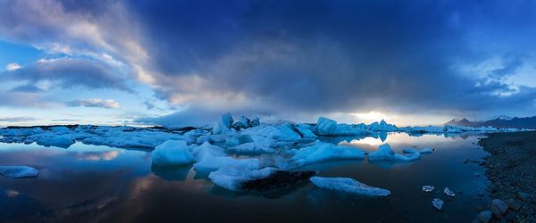 Scenic view of snowcapped landscape against sky during winter