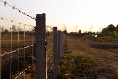 Close-up of fence on field