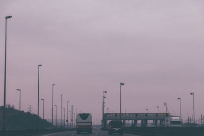 Cars on road at sunset