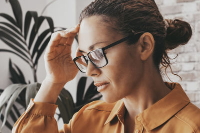 Close-up of young woman looking away