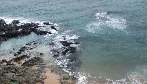 High angle view of rocks in sea