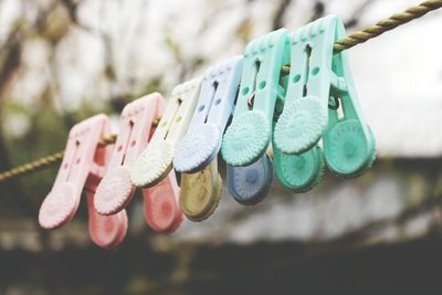 Detail shot of colorful clothes pins on wire