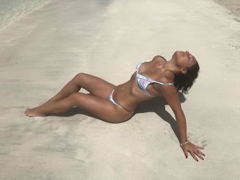 Woman lying on beach