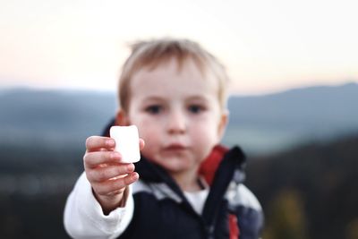 Portrait of boy holding ice cream