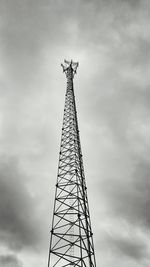 Low angle view of crane against sky