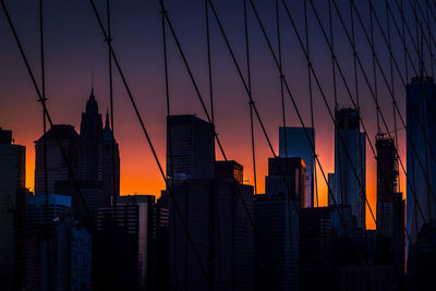 Low angle view of city at sunset