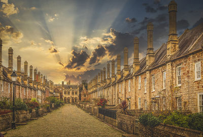 Panoramic shot of buildings against sky during sunset