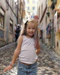 Portrait of smiling girl standing outdoors