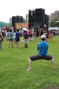 People on grassy field