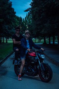 Portrait of friends riding motorcycle