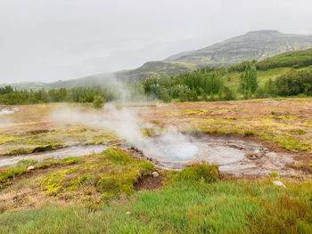 A steaming hot spring in the nature of iceland