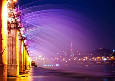 Moonlight rainbow fountain on banpo bridge over han river at night