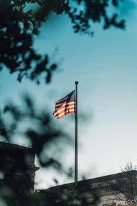 Low angle view of flag against sky