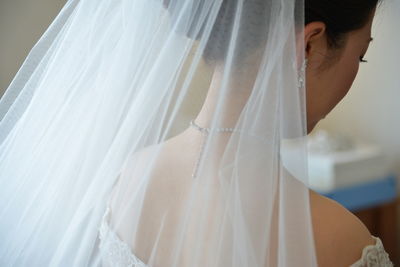 Midsection of woman with umbrella