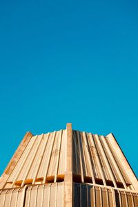 Low angle view of house against clear blue sky