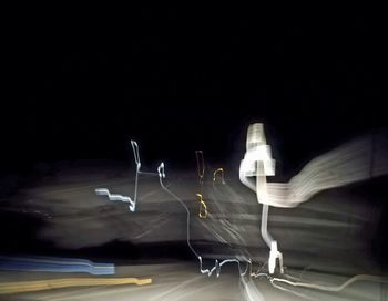 View of illuminated road at night