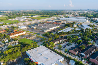 High angle view of buildings in city against sky