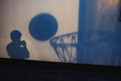 Shadow of boy on wall