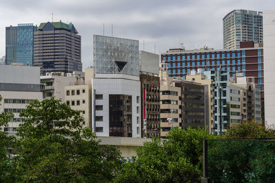 Buildings in city against sky