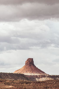 Rock formations on landscape against sky