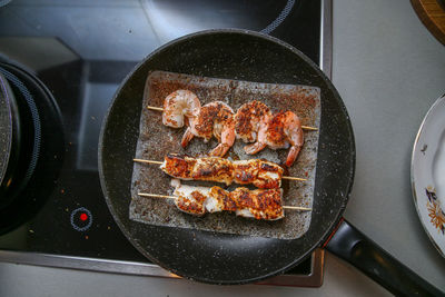 High angle view of meat in cooking pan