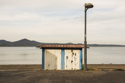 Street by sea against sky