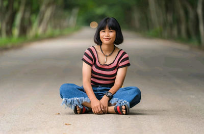Portrait of girl sitting outdoors