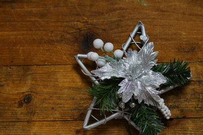 Close-up of christmas decorations on wooden table