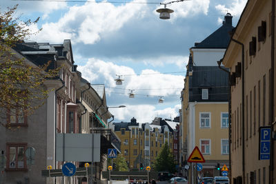 City street against cloudy sky