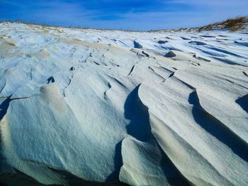 Scenic view of landscape against sky during winter