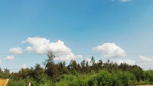 Panoramic view of landscape against blue sky