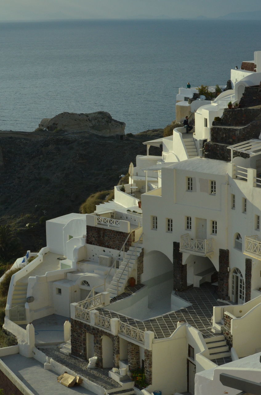 architecture, building exterior, built structure, high angle view, water, city, residential building, sea, residential structure, cityscape, building, outdoors, day, no people, residential district, nautical vessel, house, town, crowded, travel destinations