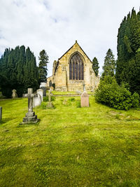 Church and cemetery against sky