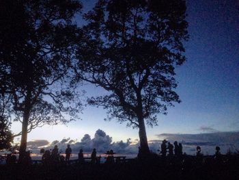 Silhouette of people at night