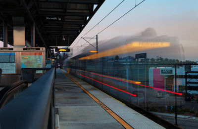 Train at railroad station against sky