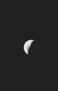 Low angle view of moon against sky at night