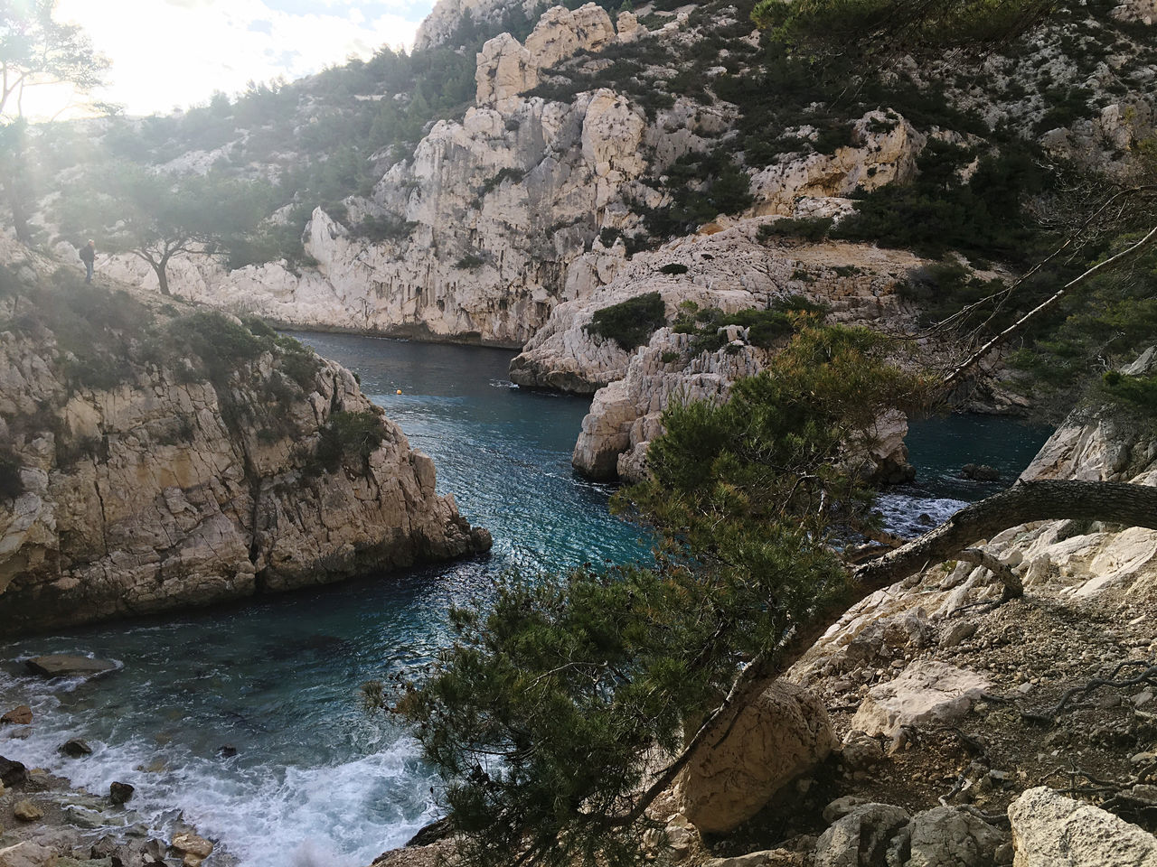 SCENIC VIEW OF RIVER FLOWING THROUGH ROCKS