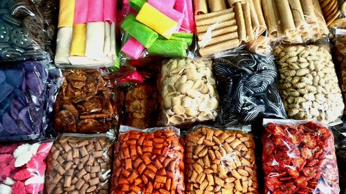 Multi colored vegetables for sale at market stall