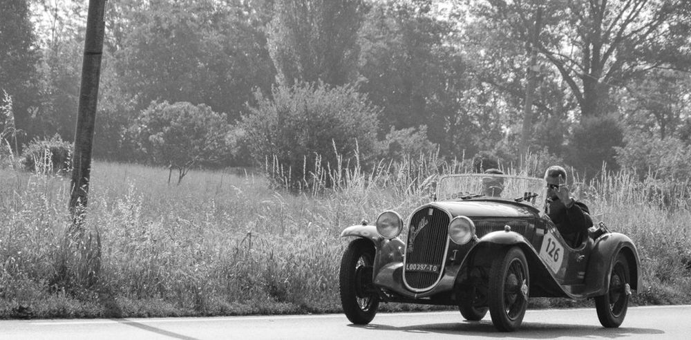 transportation, mode of transportation, car, motor vehicle, tree, plant, land vehicle, day, nature, travel, land, retro styled, road, outdoors, people, forest, field, motion, journey, wheel