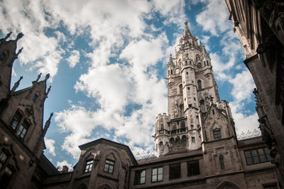 Low angle view of church against cloudy sky