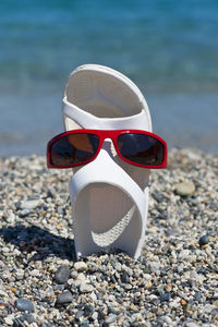 Sunglasses on rock at beach