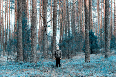 Man standing on snow covered land