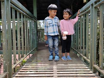 Full length of boy walking on steps