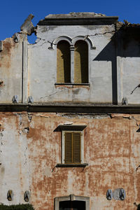 Low angle view of old building against sky