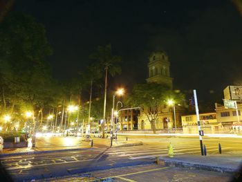 Fountain in city at night