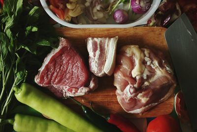 High angle view of meat on cutting board