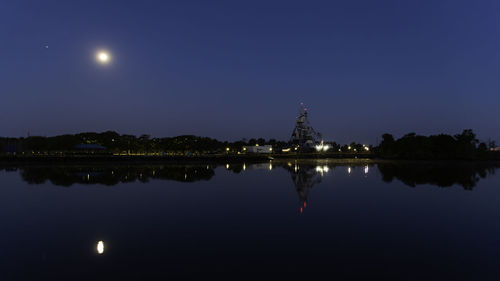 Reflection of illuminated buildings in water at night