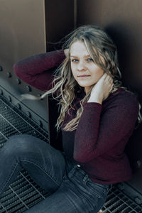 Portrait of teenage girl sitting at home