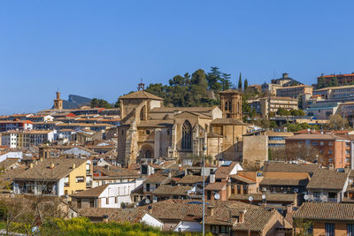 Aerial view of townscape against clear blue sky